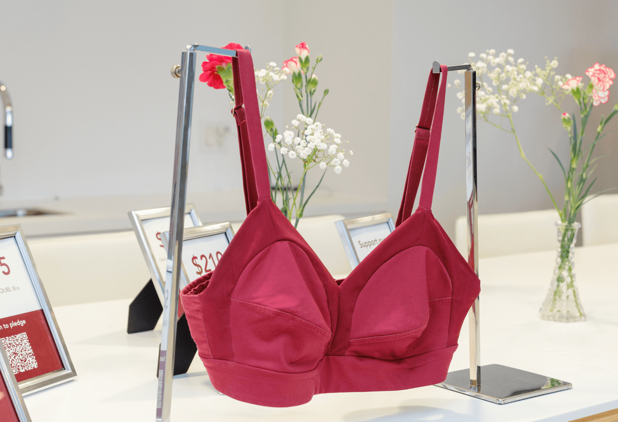 Close-up image of a custom fitted DOUBL bra hanging